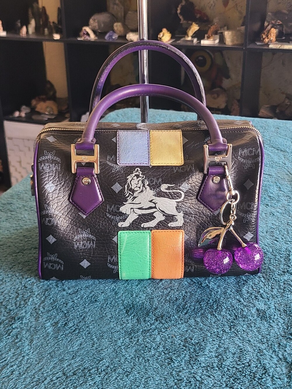 MCM Visetos Princess Lion Boston Bag in black coated canvas